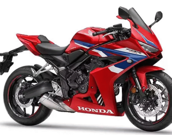 2025 Honda CBR650R side view showing red color variant and new exhaust design
