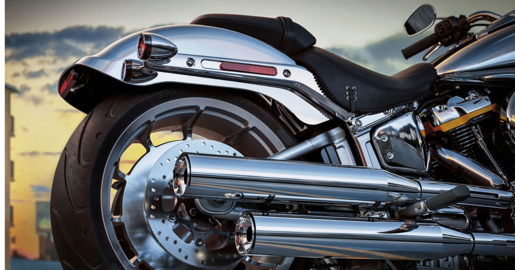 Close-up of Harley-Davidson Fat Boy Gray Ghost dual exhaust pipes with chrome finish