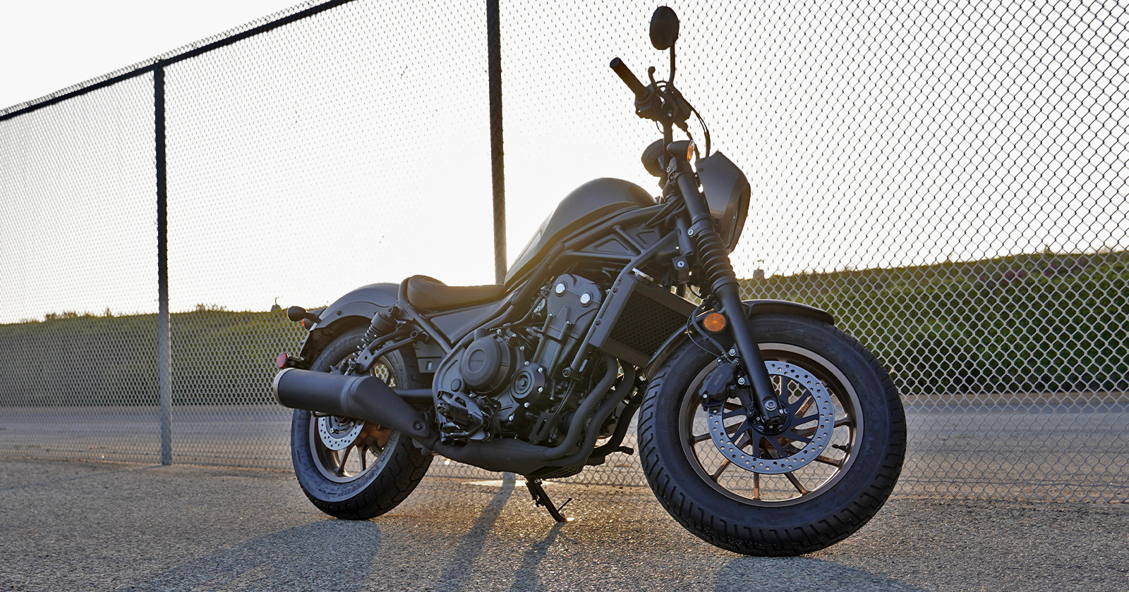Side profile of the Honda Rebel 500 in Matt Gunpowder Black Metallic