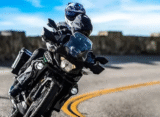 Kawasaki Versys X 300 front view with windscreen and wire-spoke wheels