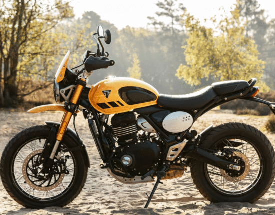 Triumph Scrambler 400 XC side profile showcasing wire-spoke wheels and raised suspension
