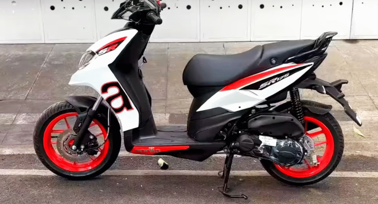 Side profile of Aprilia SR 175 highlighting its bold graphics and alloy wheels