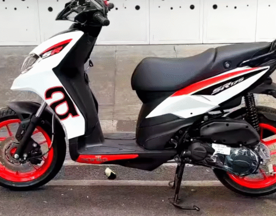 Side profile of Aprilia SR 175 highlighting its bold graphics and alloy wheels
