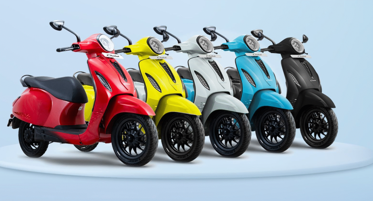 Bajaj Chetak 3001 electric scooter in red, yellow, and blue colors with stylish design and LCD display