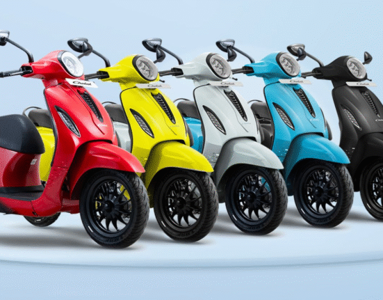 Bajaj Chetak 3001 electric scooter in red, yellow, and blue colors with stylish design and LCD display