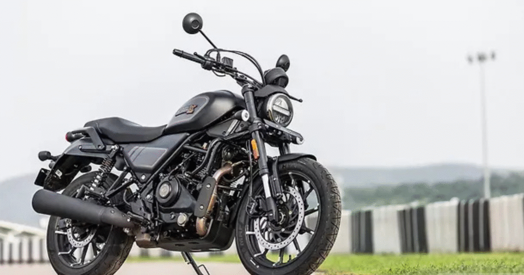 Harley-Davidson X440 in an urban backdrop, featuring its muscular fuel tank, wide handlebars, and aggressive roadster design
