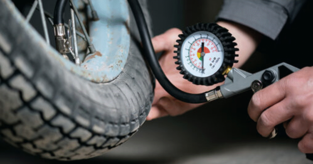 Royal Enfield Bullet 350 on a mountain trail loaded with gear need tyre pressure inspection for optimal performance