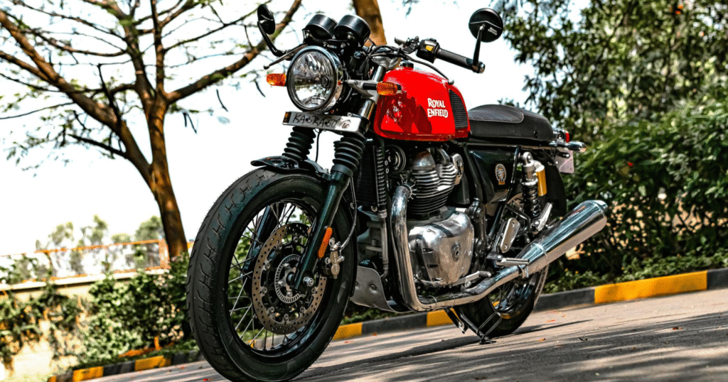 Royal Enfield Continental GT 650 café racer motorcycle parked on roadside with twin exhaust and clip-on handlebars