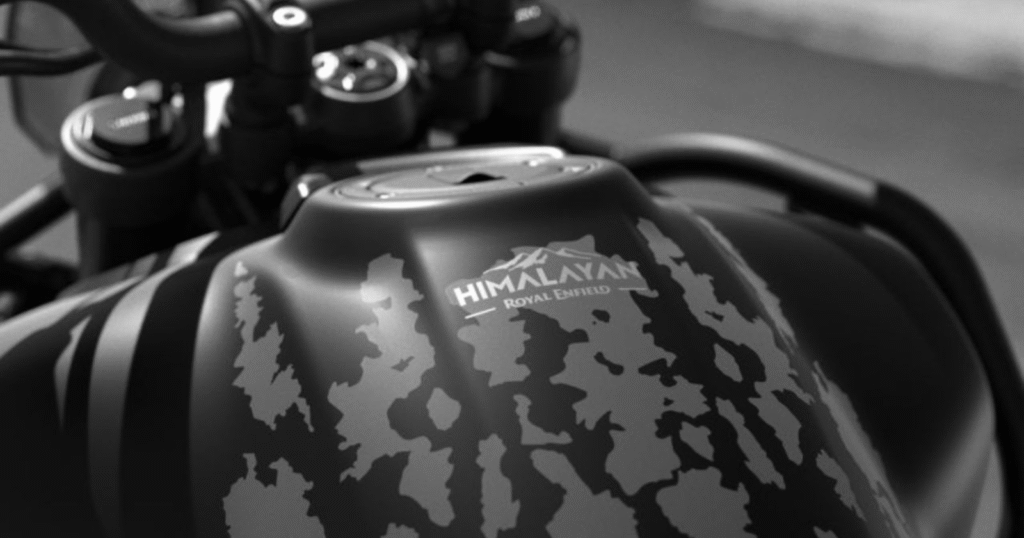 Close-up of Royal Enfield Himalayan 450 Mana Black Edition tank badging with stealth black livery and Royal Enfield branding