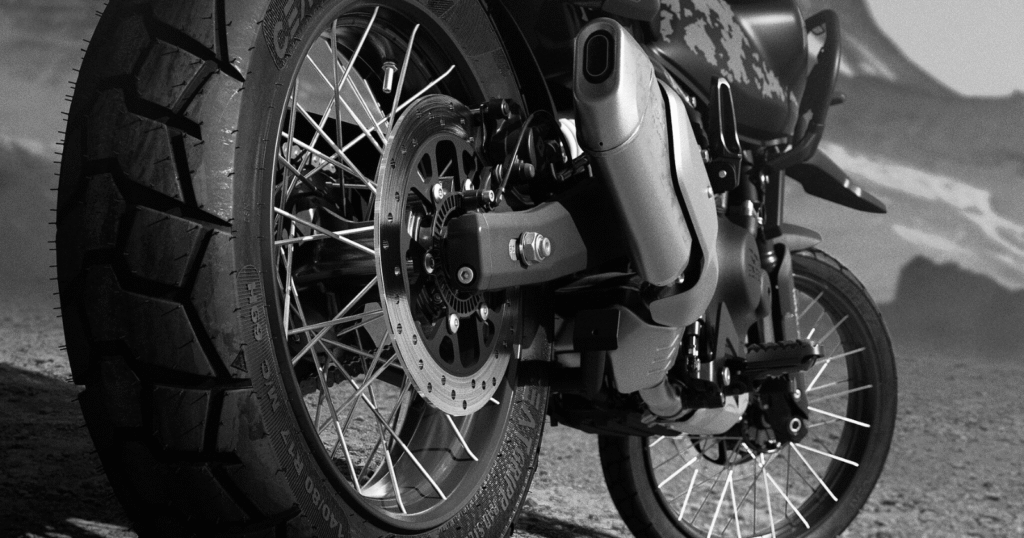 Royal Enfield Himalayan 450 Mana Black Edition rear wheel and exhaust design with tubeless spoked wheels and black matte finish