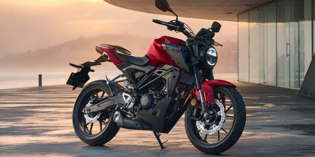 Side view of the Honda CB125R in Matt Pearl Diaspro Red Colour highlighting the round LED headlamp and sculpted tank design