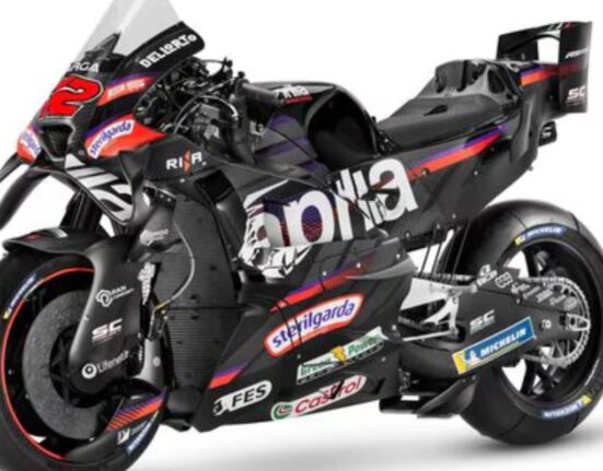 Side profile of the Aprilia RS-GP26 MotoGP bike revealing chassis layout, exhaust system, and rear aerodynamic elements