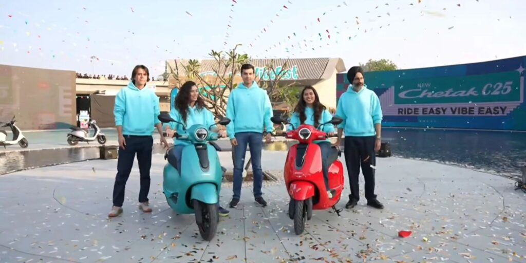 Bajaj officials and riders pose with Chetak C2501 electric scooters at launch ceremony