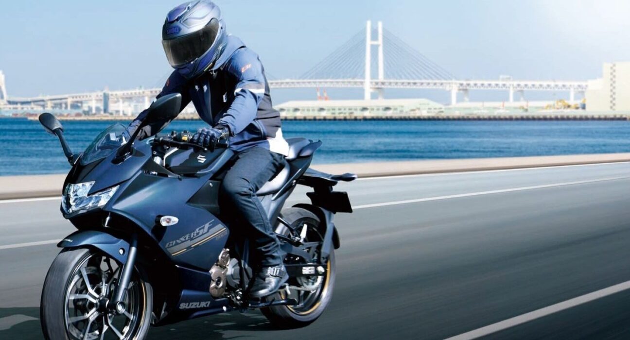 Rider riding the 2026 Suzuki Gixxer SF 250 on an open road showcasing the new black colour scheme