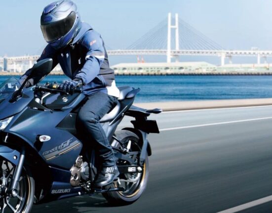 Rider riding the 2026 Suzuki Gixxer SF 250 on an open road showcasing the new black colour scheme