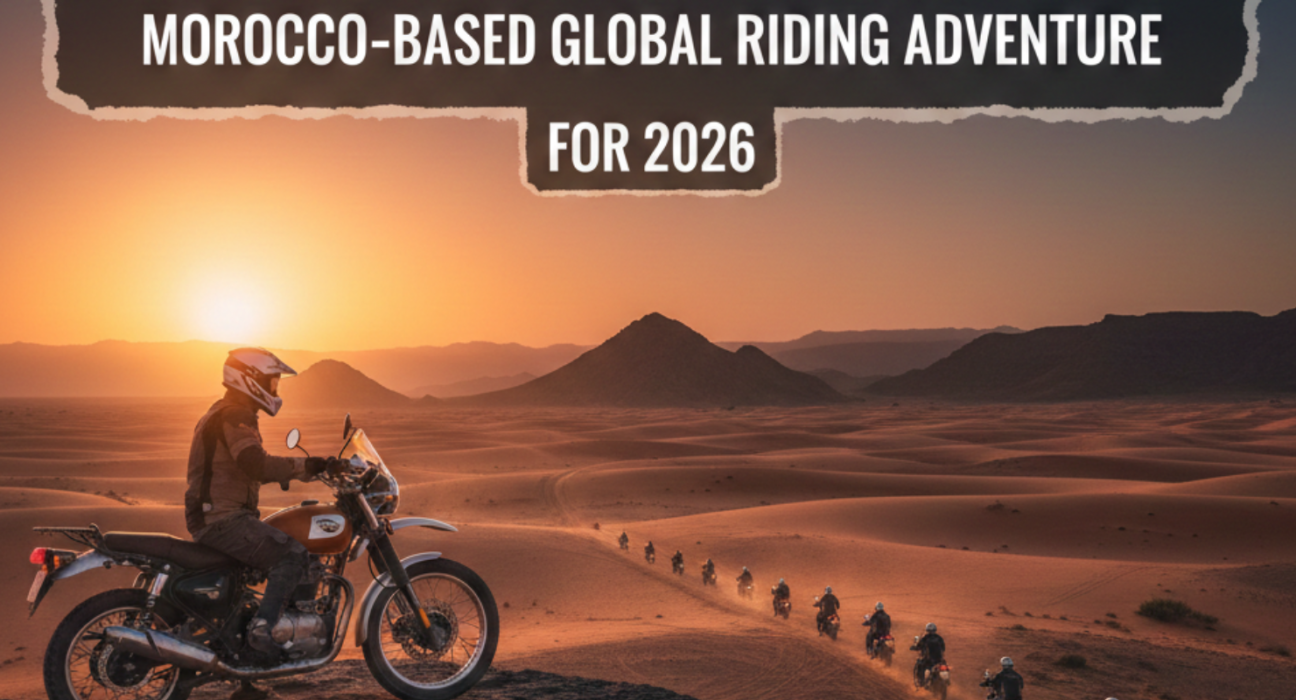 Royal Enfield motorcycle convoy riding through Sahara desert at sunset in Morocco